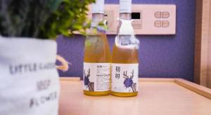 two bottles of sauce sitting on top of a table at Lavande Hotels Harbin Railway Station Zhanqian Square in Harbin