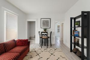 a living room with a couch and a table at Spacious 4BR Family Home in Detroit WiFi Parking in Detroit
