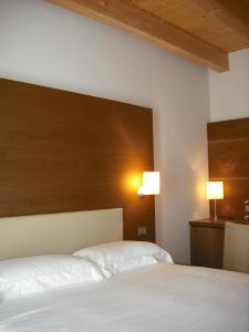 Postel nebo postele na pokoji v ubytování Hotel Operà