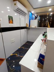 a small kitchen with a counter and a counter top at Hotel Prince Bodh Gaya in Bodh Gaya