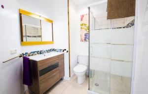 a bathroom with a toilet and a sink and a shower at Casarosaenea in Olite