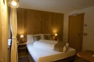Agriturismo Baita De L'ALL客房内的一张或多张床位