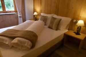 Agriturismo Baita De L'ALL客房内的一张或多张床位