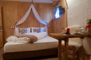 Agriturismo Baita De L'ALL客房内的一张或多张床位