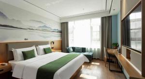 Postel nebo postele na pokoji v ubytování Green Tree Inn Henan Jiyuan Tiantan Road Xinyao Plaza + 208 fotografií