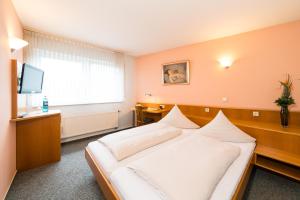 Postel nebo postele na pokoji v ubytování Hotel Restaurant Vater Rhein