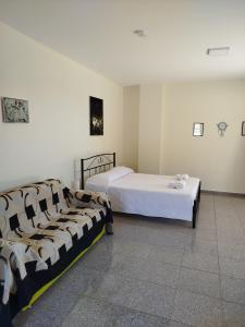 two beds in a room with two bedsvisor at Nereids Apartments-Pronoe in Petalidhion