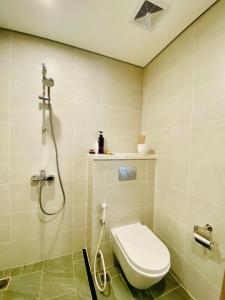 a bathroom with a toilet and a shower at Shi House - Studios Building GH6 Near Vincom& Park in Long Bình +34 photos