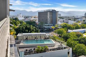 a swimming pool on the roof of a building at Cairns Coastal Charmer - Your Waterfront Sanctuary in Cairns