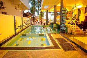 a swimming pool in the middle of a building at The Bay in Arugam Bay