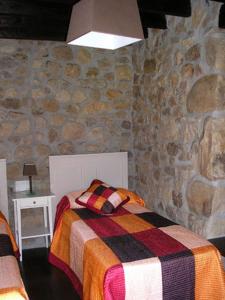 Кровать или кровати в номере Apartamentos El Rincon Encantado