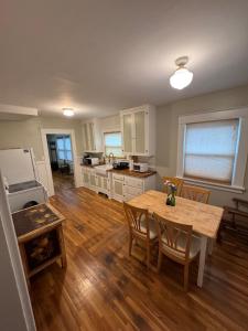 a kitchen and dining room with a table and chairs at Brick Bungalow 1 block to I80 charmingly renovated in Reno