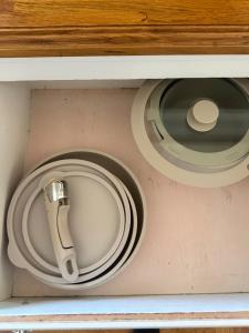 a drawer with a plate and a sink at Brick Bungalow 1 block to I80 charmingly renovated in Reno +19 photos