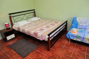 Postel nebo postele na pokoji v ubytování Chez Ronald Guest House