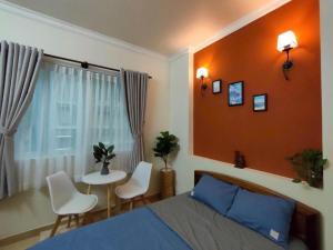 Ένα ή περισσότερα κρεβάτια σε δωμάτιο στο ST Hotel