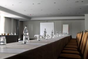 a long table in a room with bottles on it at Hotel Alicante Golf in Alicante +126 photos