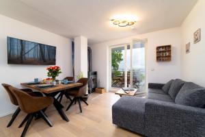 a living room with a table and a couch at FeWo Sonnenschein in Sassnitz