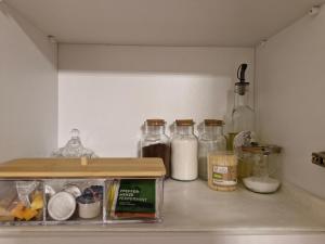 a kitchen counter with bottles of milk and other ingredients at Old Town Maglaj 2, Center ,Parking in Maglaj +13 photos