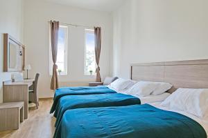 Postel nebo postele na pokoji v ubytování Hotel Kringelstaden