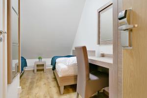 Postel nebo postele na pokoji v ubytování Hotel Kringelstaden