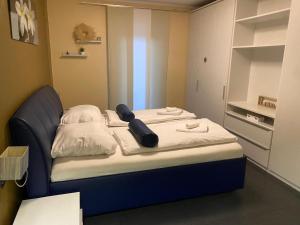 Ένα ή περισσότερα κρεβάτια σε δωμάτιο στο Familienhaus mit Garten, Terrasse & Grill