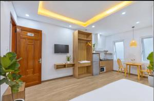 a living room with a kitchen and a dining room at apartment in Da Nang