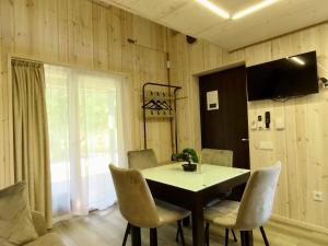 a dining room with a table and chairs at Gray House in Marijampolė