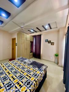 a bedroom with a bed in a room at Sk property in Islamabad