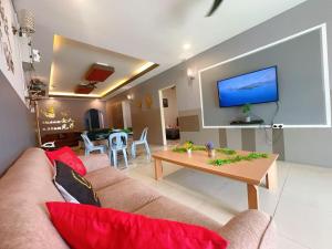 a living room with a couch and a table at B02 Party House Bungalow 20 PAX in Johor Bahru