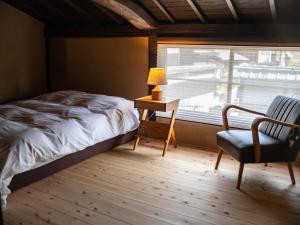 Un pat sau paturi într-o cameră la Kominka Hotel kurasu - Vacation STAY 93194v
