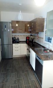 A kitchen or kitchenette at Beach Suite Playa Cala dor
