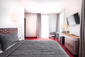Postel nebo postele na pokoji v ubytování Viešbutis Simpatija