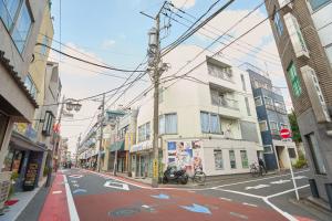 an empty city street with buildings and a street sign at 25 min to Shibuya by Train 1 min to Sta 86 square meters in Kugayama