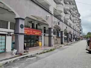 an empty street in front of a building at Ed 03 lumut Waterfront in Lumut