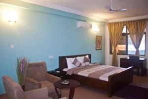 Giường trong phòng chung tại Consir Executive Lodge +40 ảnh