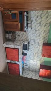 an overhead view of a kitchen with a microwave at Prisca home news 
