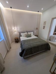 Postel nebo postele na pokoji v ubytování Eriad Patras - Calm Luxury Stay In The City Centre + 36 fotografií