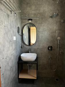 a bathroom with a sink and a mirror at Felix Inn Boutique Hotel - Manyata Tech Park in Bengaluru