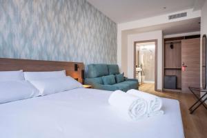 Ένα ή περισσότερα κρεβάτια σε δωμάτιο στο Alora Hotel Mérida +8 φωτογραφίες