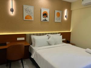 Ένα ή περισσότερα κρεβάτια σε δωμάτιο στο Felix Inn Boutique Hotel - Manyata Tech Park