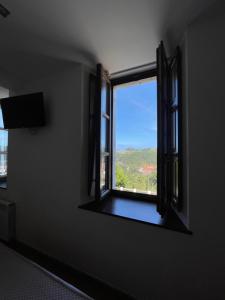 a window in a room with a view at Hotel Villadesella in Ribadesella