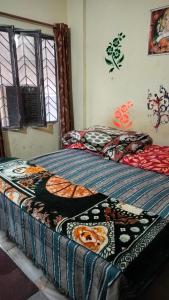 Postel nebo postele na pokoji v ubytování Raghunath bhawan