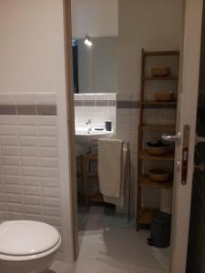 a bathroom with a white toilet and a sink at Casa Ternavassi in Carmagnola +16 photos
