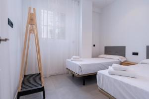 Ένα ή περισσότερα κρεβάτια σε δωμάτιο στο Panther Home Triana Deluxe