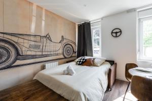 Ένα ή περισσότερα κρεβάτια σε δωμάτιο στο Automobile