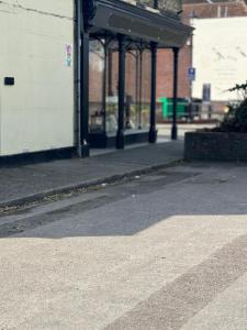 an empty street with a building in the background at Marina Lodge in Gosport