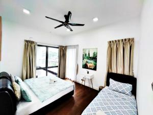 a bedroom with a bed and a ceiling fan at Imago Loft Residences - By The Pool in Kota Kinabalu +56 photos