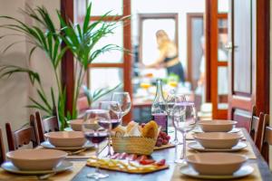 a table with plates of food and wine glasses at Casa Casanova in Benissa +26 photos