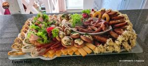 a platter of different types of food on a table at Vilimu Sodyba - Event Hall in Kriukai +27 photos