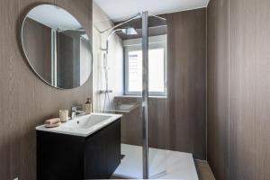 a bathroom with a sink and a mirror at Alsace in Mulhouse